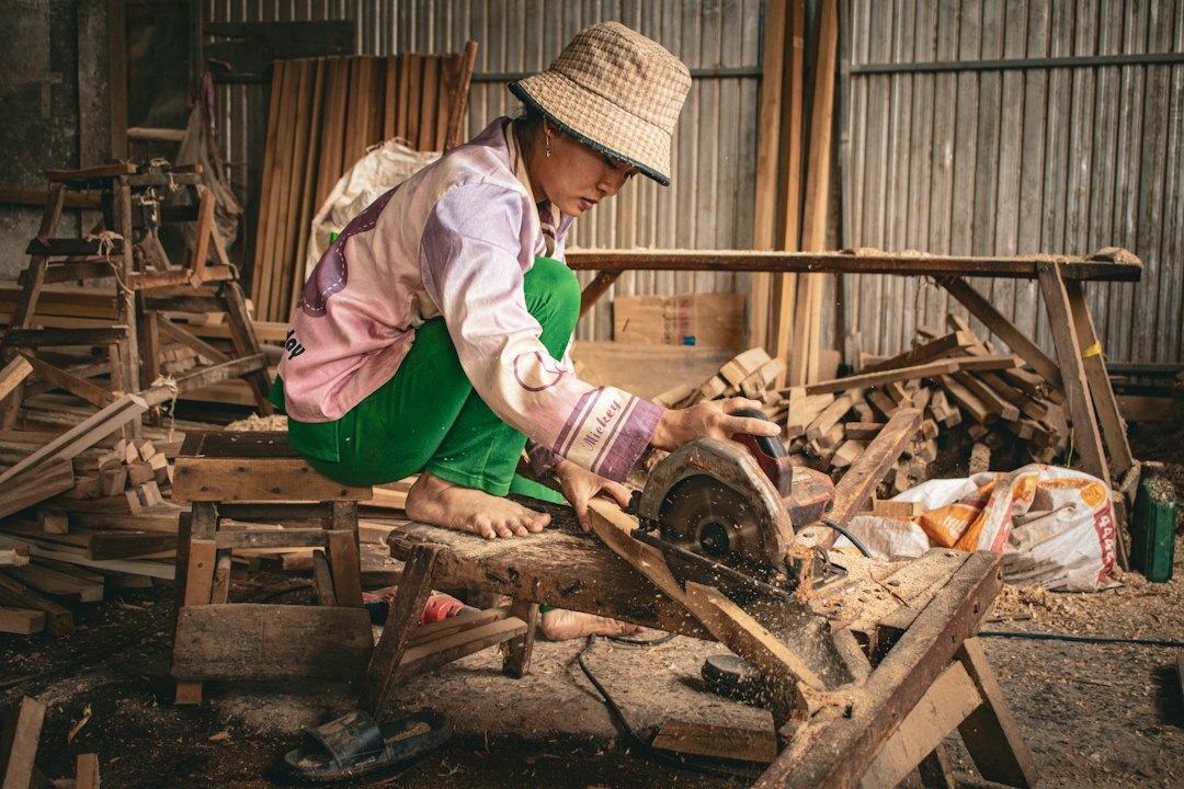 Craftsman working with wood tools in a small workshop